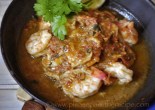 Sizzling Prawns with ginger lime and chilli garnished with lime and coriander